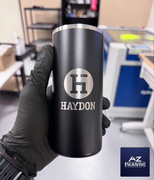 Custom engraved tumbler showing detailed laser logo work